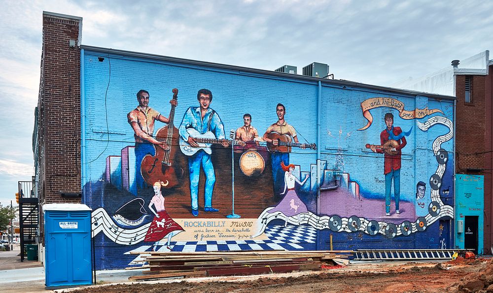                         A rockabilly-themed mural features country music star Carl Perkins and his band alongside British…