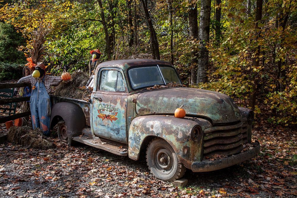                         Fall decorations spruce up an old truck at the entrance to the Oak Haven Resort near the town of…