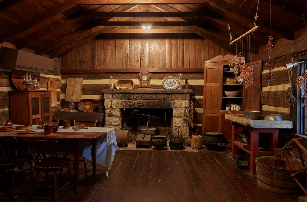                         Inside a separate kitchen building behind the two-story log cabin at James White's Fort, built in…