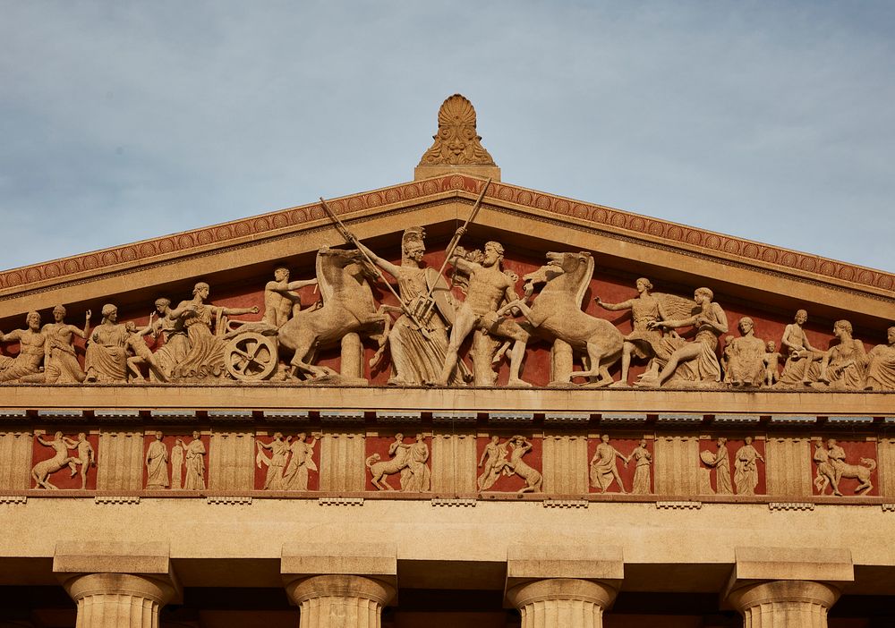                         The ornate triangular pediment of the city's own full-scale replica of Athens, Greece's Parthenon in…