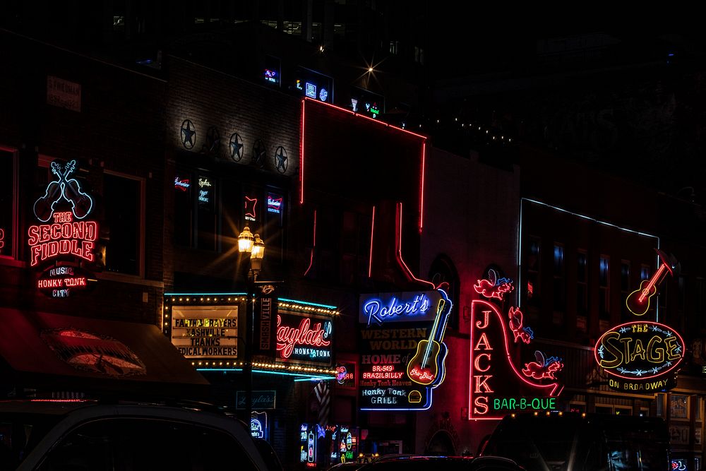                         Neon signs along Broadway, the often raucous street that is the center of the entertainment scene in…