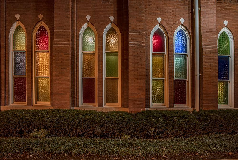                         Nighttime view of the colorful, church-like windows of Ryman Auditorium, the historic venue for…