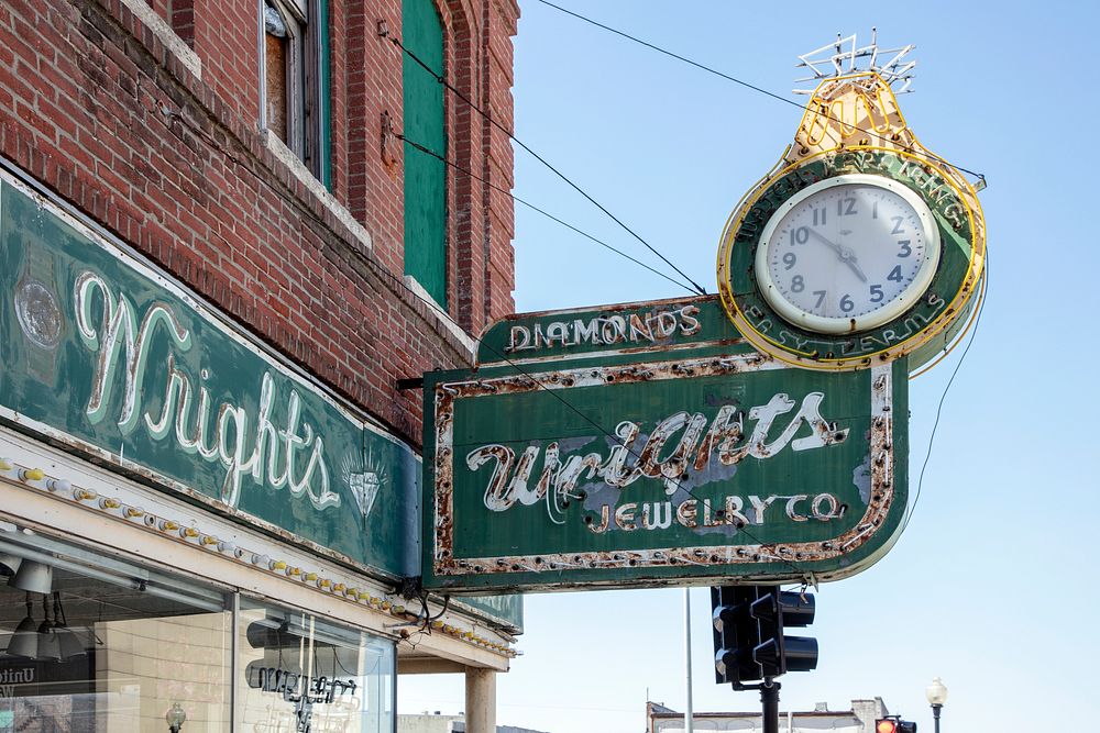                         A handsome street clock and overhead sign for Wright's Jewelry Store in St. Joseph, the principal…