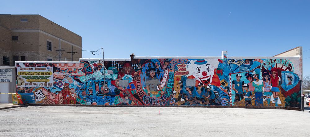                         A flamboyant mural depicting many elements of an amusement park in Kansas City, Kansas              …
