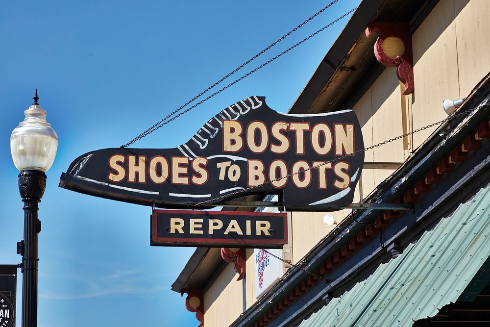                         Sign for a boot and shoe-repair shop in downtown Yankton, a small city on the Missouri River and the…