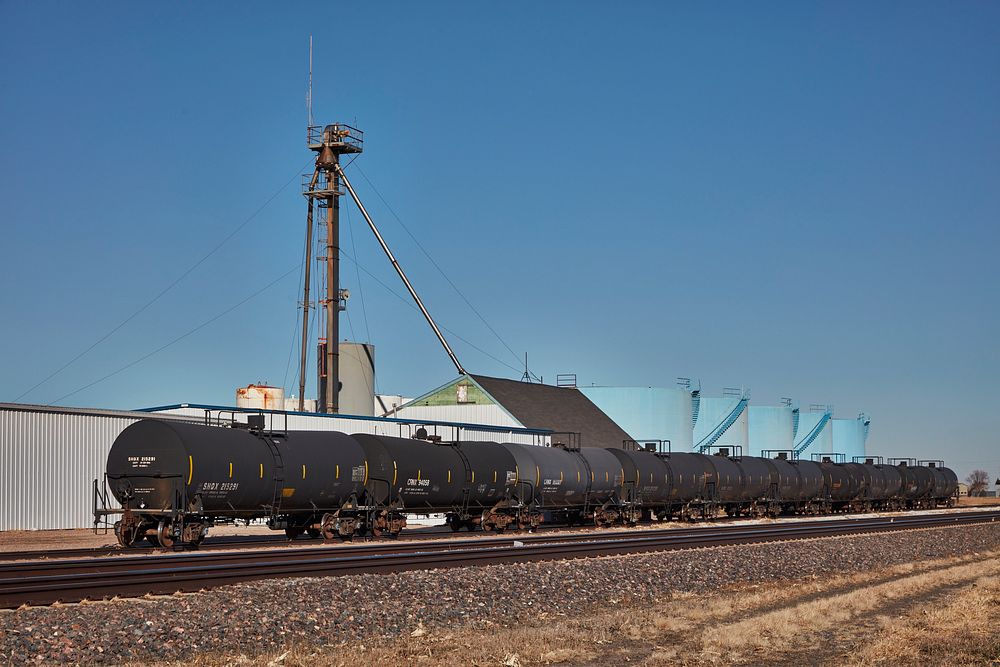                         A line of oil tanker rail cars on a siding in Merrick County, Nebraska                        