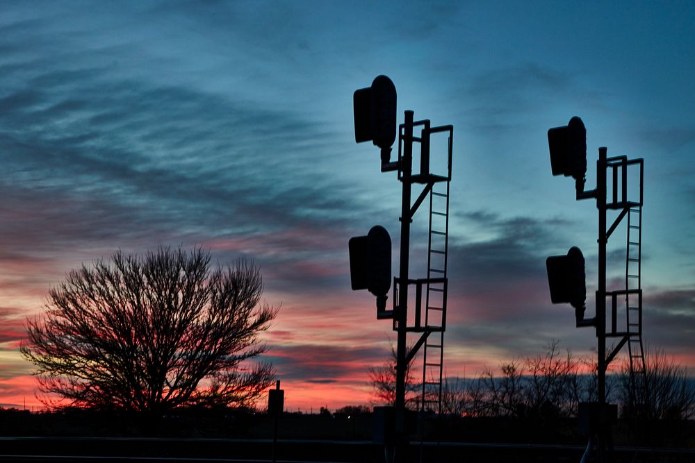                         Sunset view of railroad signals along the Grand Island railroad line in Chapman, Nebraska           …