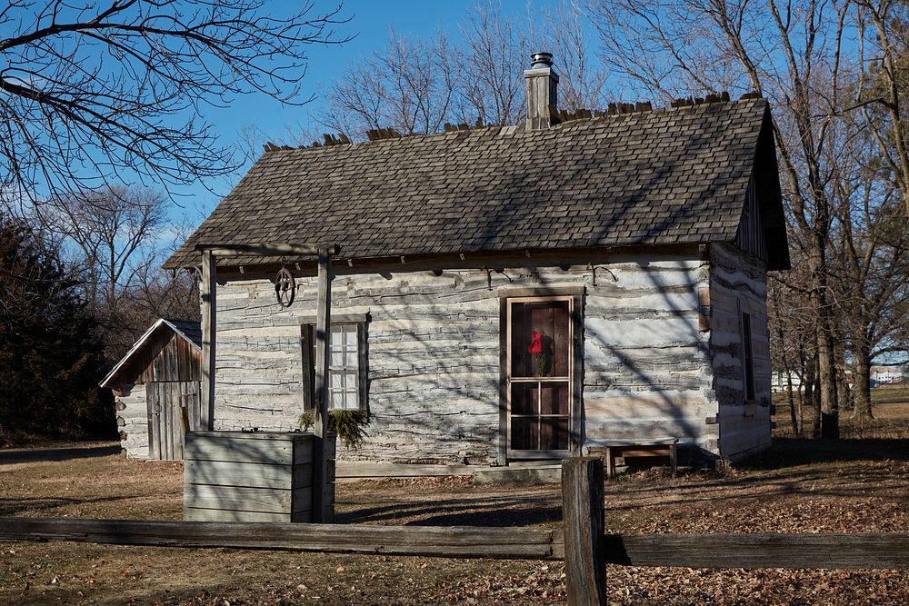                         The circa-1859 Menck Cabin at the Railroad Town outdoor living-history exhibit, with homes, trades…