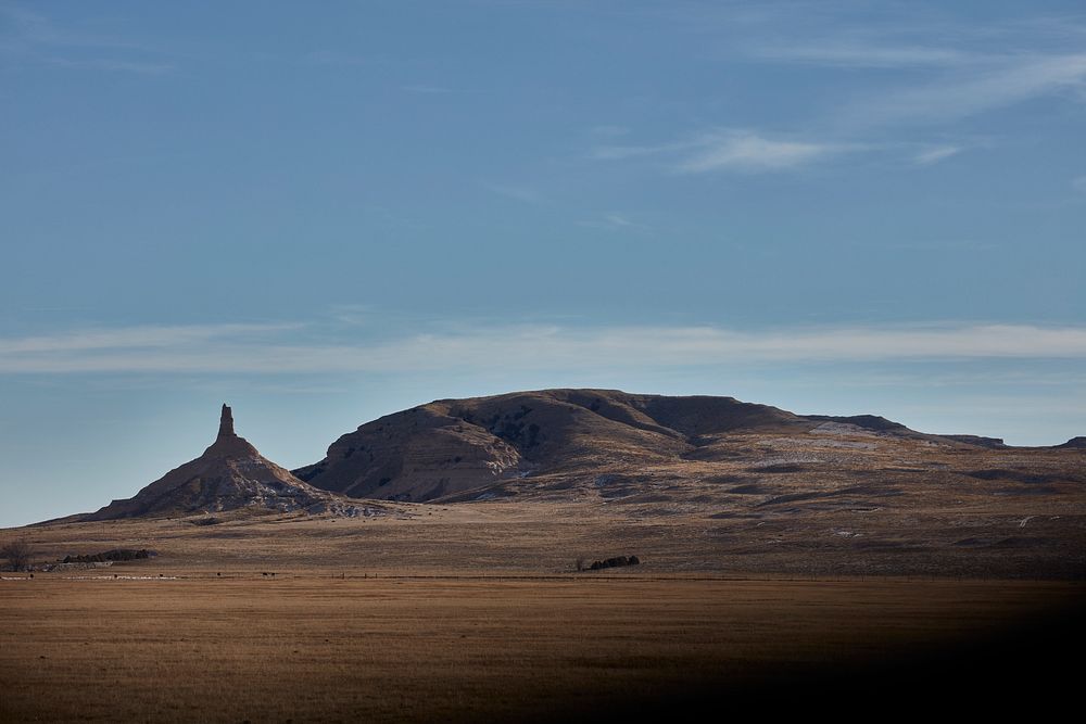                         The iconic Chimney Rock, now a U.S. national monument, stands out in the distance in Morrill County…