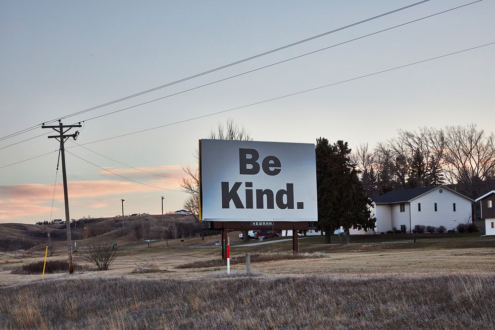                         The "Be Kind" billboard, whose message origin or intent is unexplained, outside Minot (pronounced…