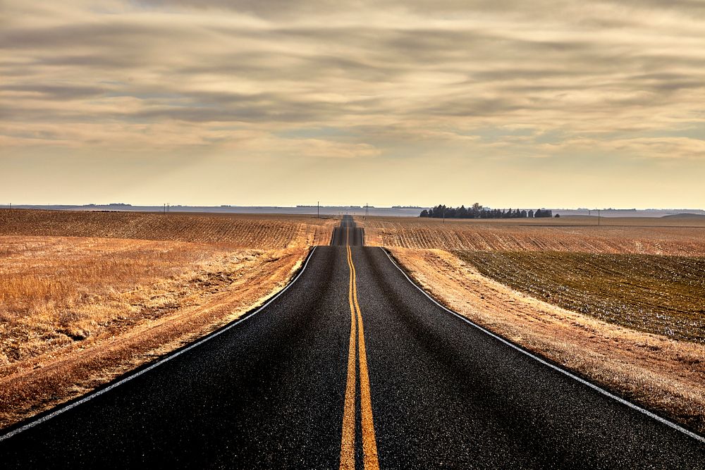                         A rolling Nebraska country road between December snowstorms, near the little village of Keystone    …