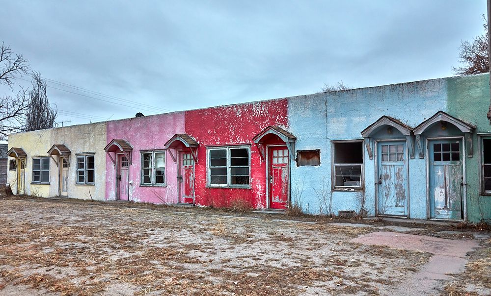                         A very, very old, long-abandoned motel whose colorful facade remains strikingly visible (if fading)…