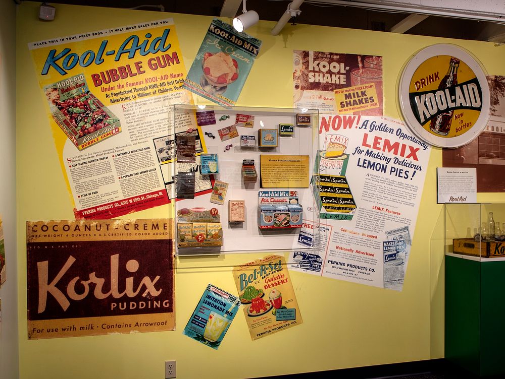                         A soft-drink exhibit, including a drink box advertising Kool-Aid, a flavored soft-drink powder in…