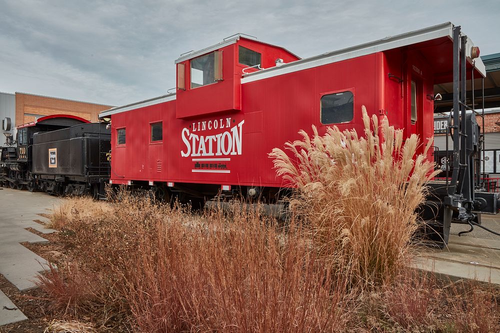                         Train cars outside the old Burlington Railroad depot, now called Lincoln Station, that anchors the…