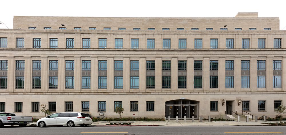                         The John A. Campbell U.S. Courthouse in Mobile, Alabama is a white, limestone building resting on a…