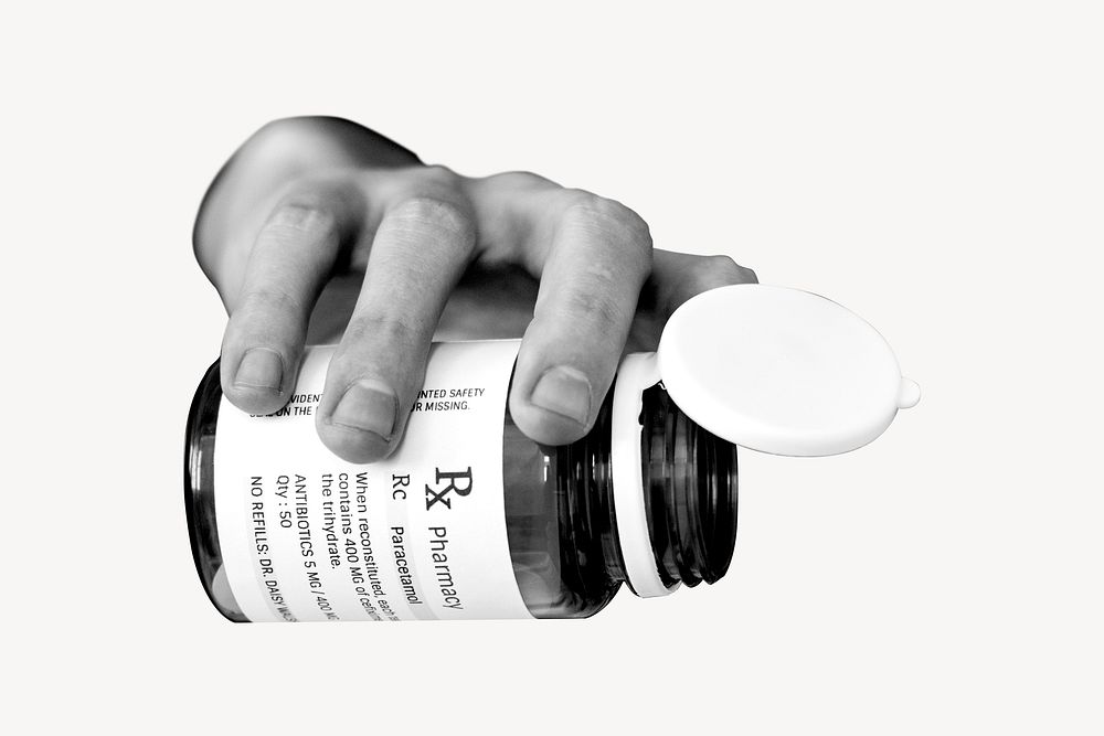Hand pouring medicine from bottle psd