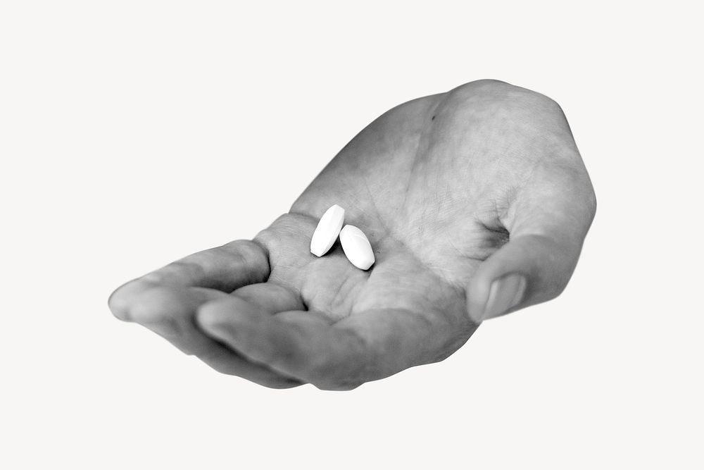 Medicine tablets on patient's hand psd