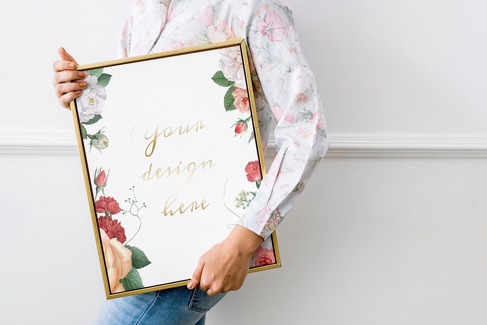 Woman holding a floral frame mockup