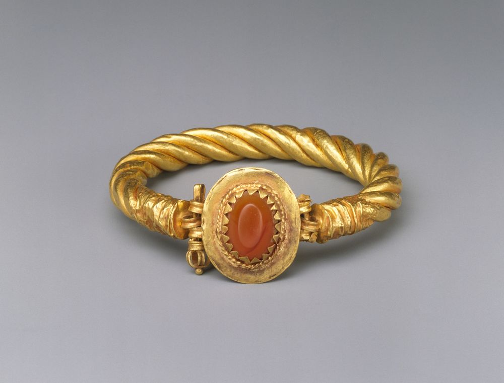 Gold bracelet with a carnelian stone
