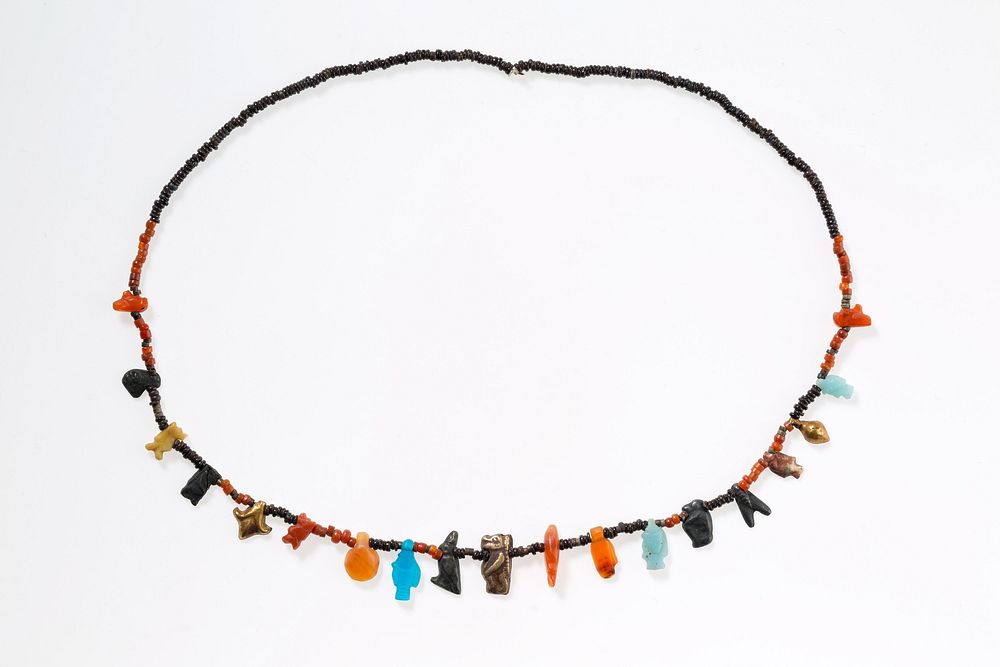 Necklace with disc beads and amulets