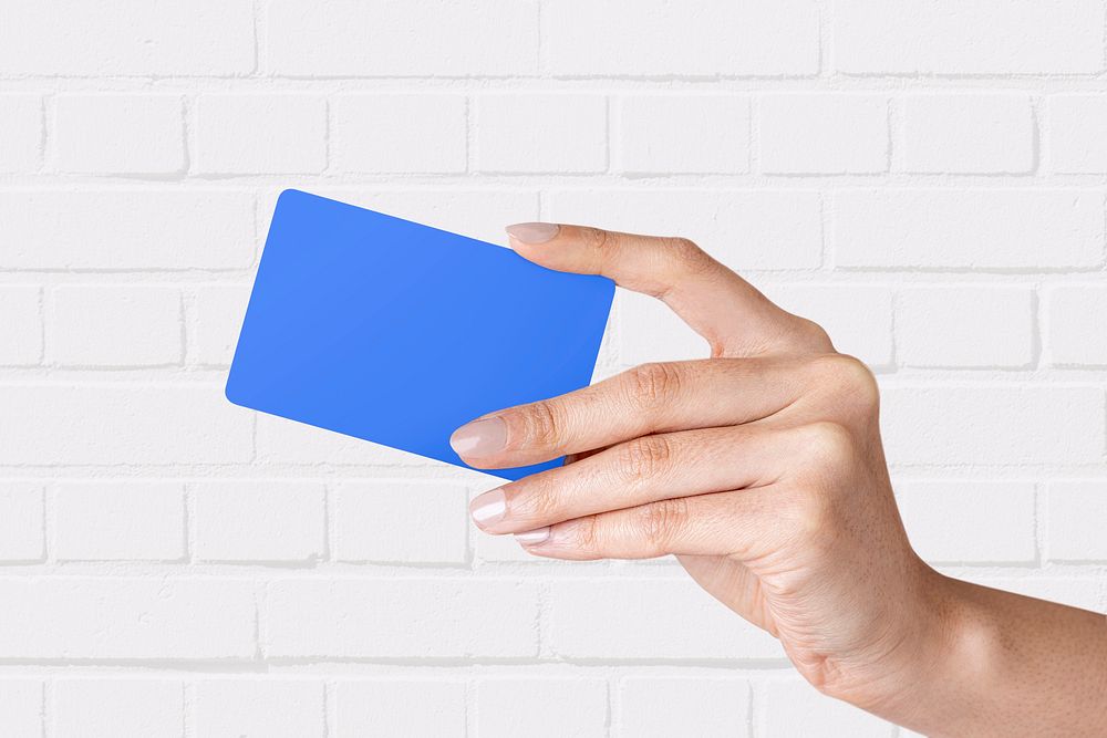 Hand holding blank blue card