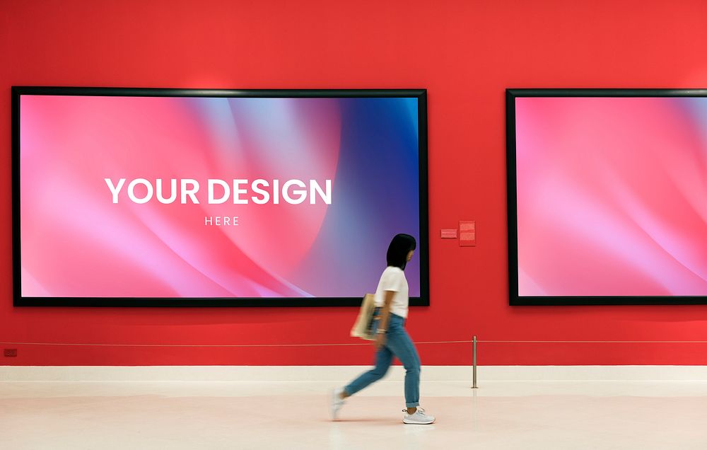 Woman walking past an art exhibition