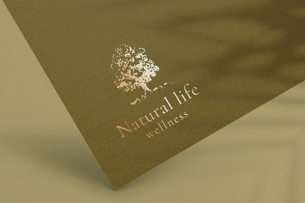 Tree logo mockup, gold paper pressed for wellness business psd
