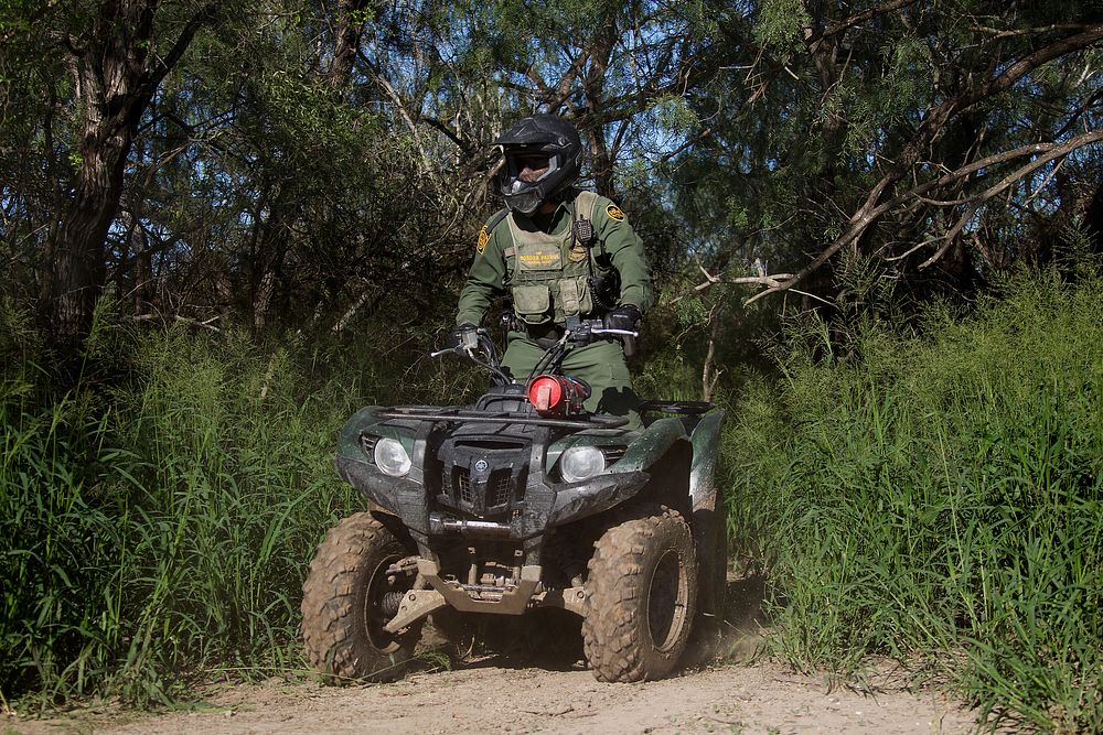Border Patrol Agent Patrols South Texas Border on an All Terrain Vehicle (ATV)