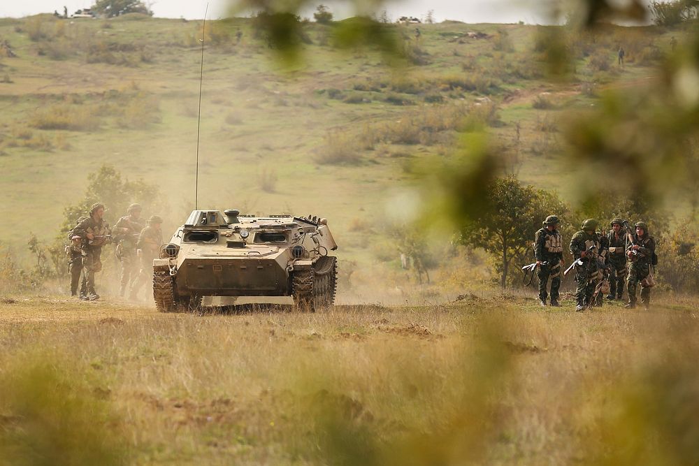 After locating and destroying a simulated enemy's primary defense location, U.S. and Bulgarian forces depart from the battle…