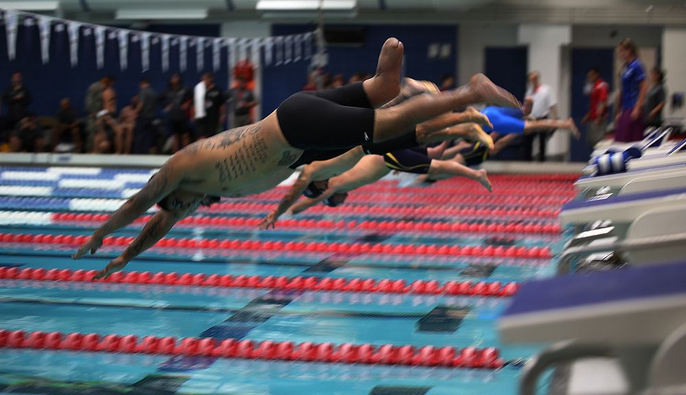 U.S. Marine Corps Sgt. Alex Nguyen takes off for the 50-meter freestyle swim event during the 2014 Warrior Games at the U.S.…