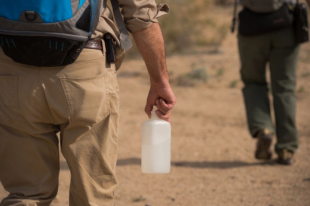 General Park Ranger carrying water in the Desert