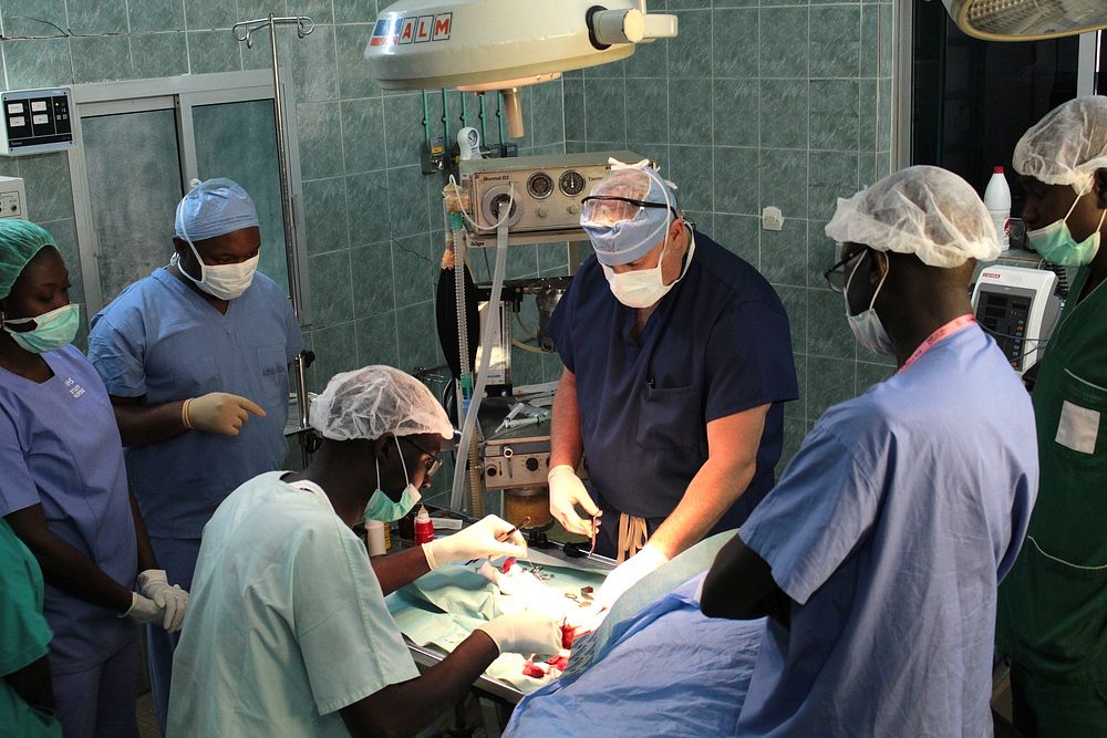 General surgeons U.S. Army Lt. Col. Charles Boggs, of 345th Combat Support Hospital, and Senegalese Defense Force Maj. Diop…