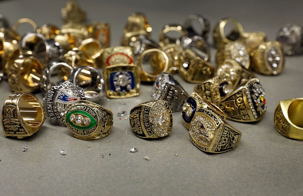 Recently confiscated counterfeit Super Bowl rings lay on a table at a U.S. Customs and Border Protection Office of Field…