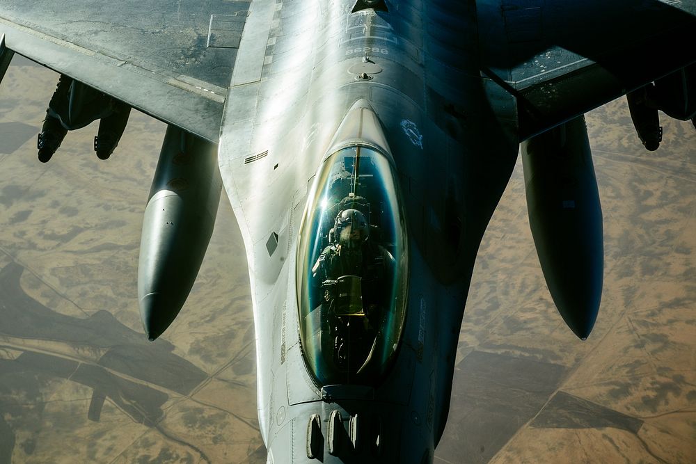 A U.S. Air Force F-16 Fighting Falcon refuels from a 340th Expeditionary Air Refueling Squadron KC-135 Stratotanker over…