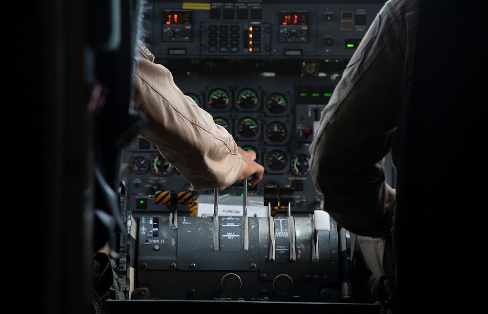 A U.S. Customs and Border Protection Air and Marine Operations air interdiction agent keeps his hands on the controls as he…
