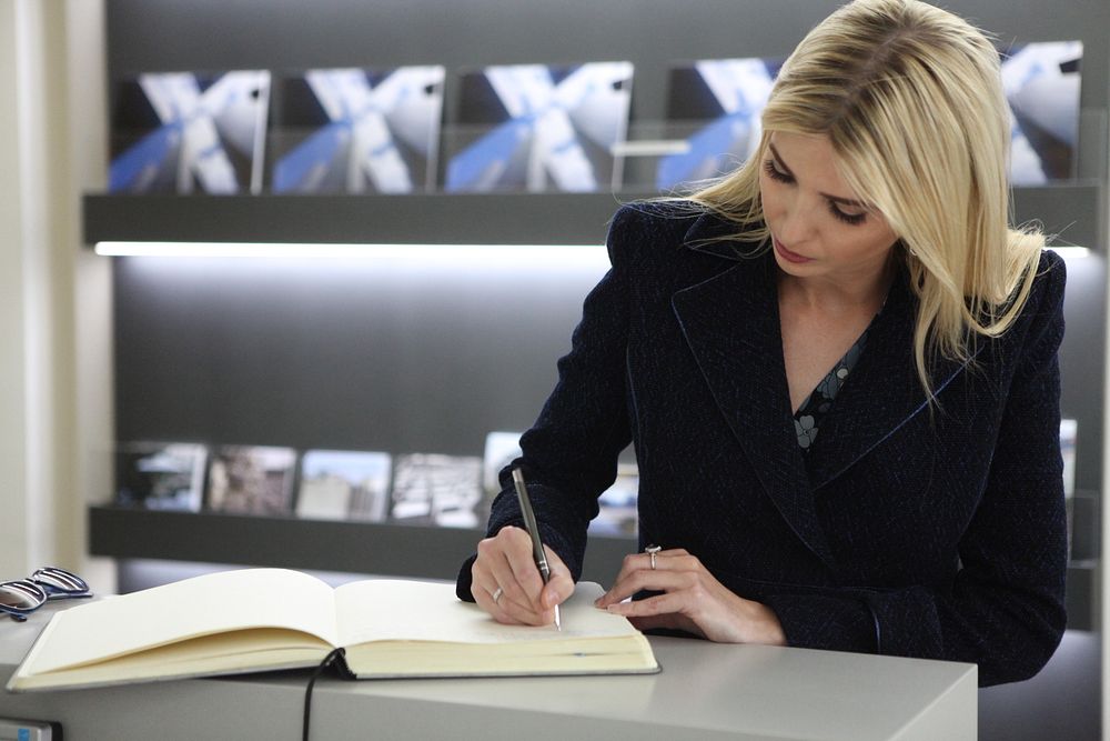 Ivanka Trump signs the Guestbook at the Holocaust Memorial. Original public domain image from Flickr