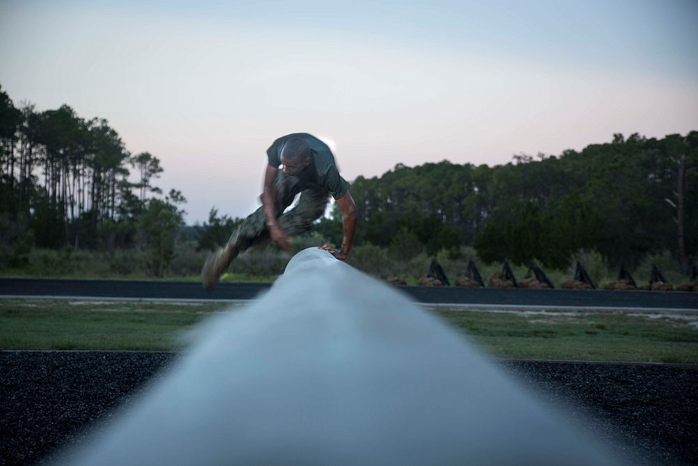 A U.S. Marine Corps recruit of Lima Company, 3rd Recruit Training Battalion, jumps over an obstacle Aug. 17, 2017, on Parris…