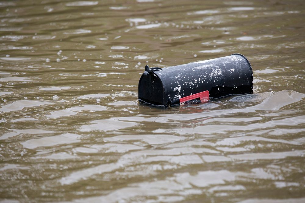 A mail box narrowly breaks the surface above a flooded street in a suburb of Houston, Texas, as U.S Border Patrol riverine…