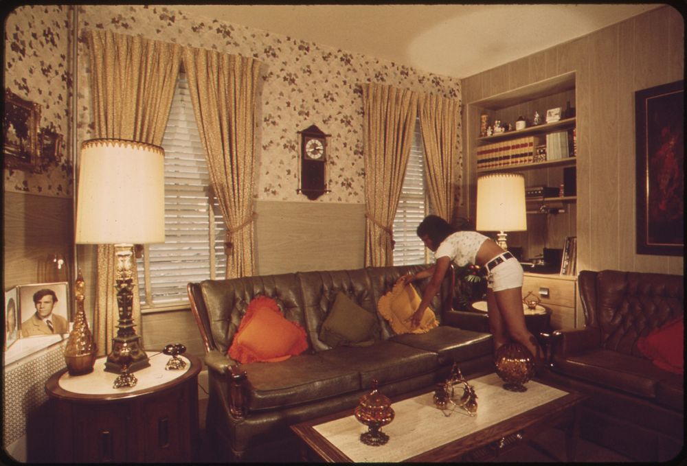Sandra Bruno Straightens a Pillow in the Immaculate Living Room of Her Family's Home at 39 Neptune Road. Original public…