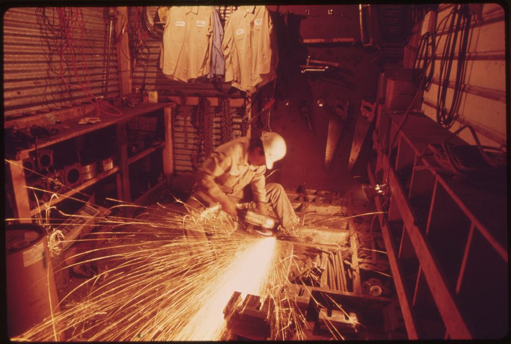 Machinery Being Repaired at a Cedar Mill near Leakey, Texas and San Antonio, 12/1973. Original public domain image from…