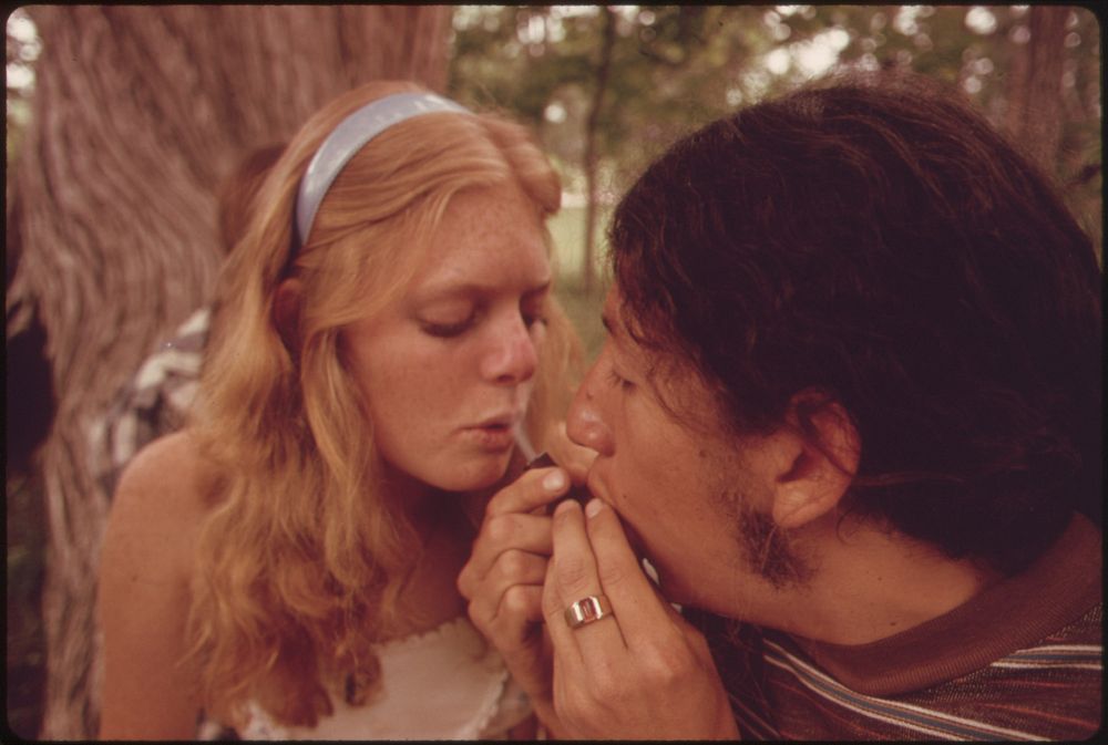 Boy and Girl Smoking Pot During an Outing in Cedar Woods near Leakey, Texas. Original public domain image from Flickr