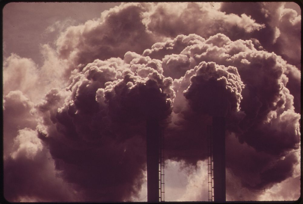 Sulphur fumes pour out of the smokestacks of the Olin Mathieson Chemical Plant. Original public domain image from Flickr