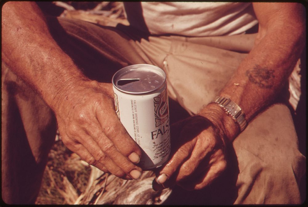 Man holding beer can. Original public domain image from Flickr