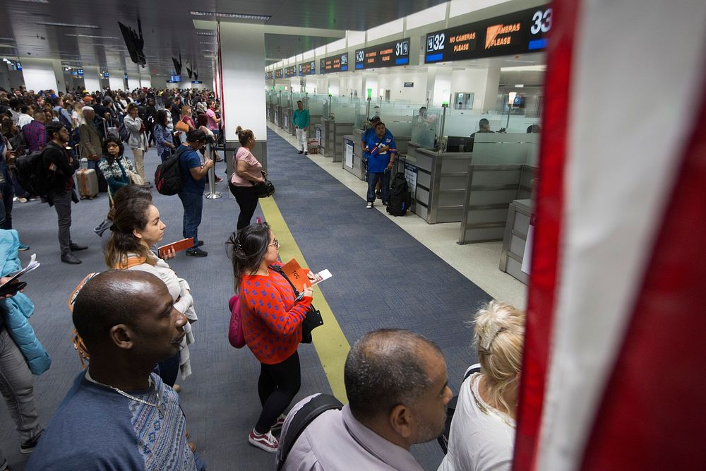 U.S. Customs and Border Protection, Office of Field Operations, officers conduct standard arrival screening operations at…