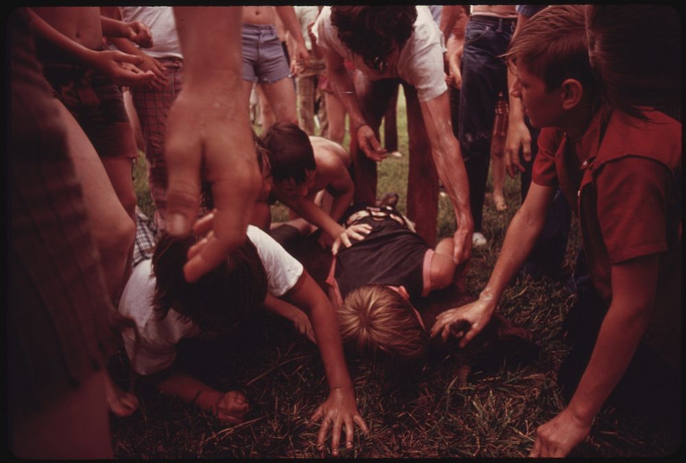 Youngsters Wrestle with a Greased Pig During a Contest Held by the Tennessee Consolidated Coal Company During Their First…