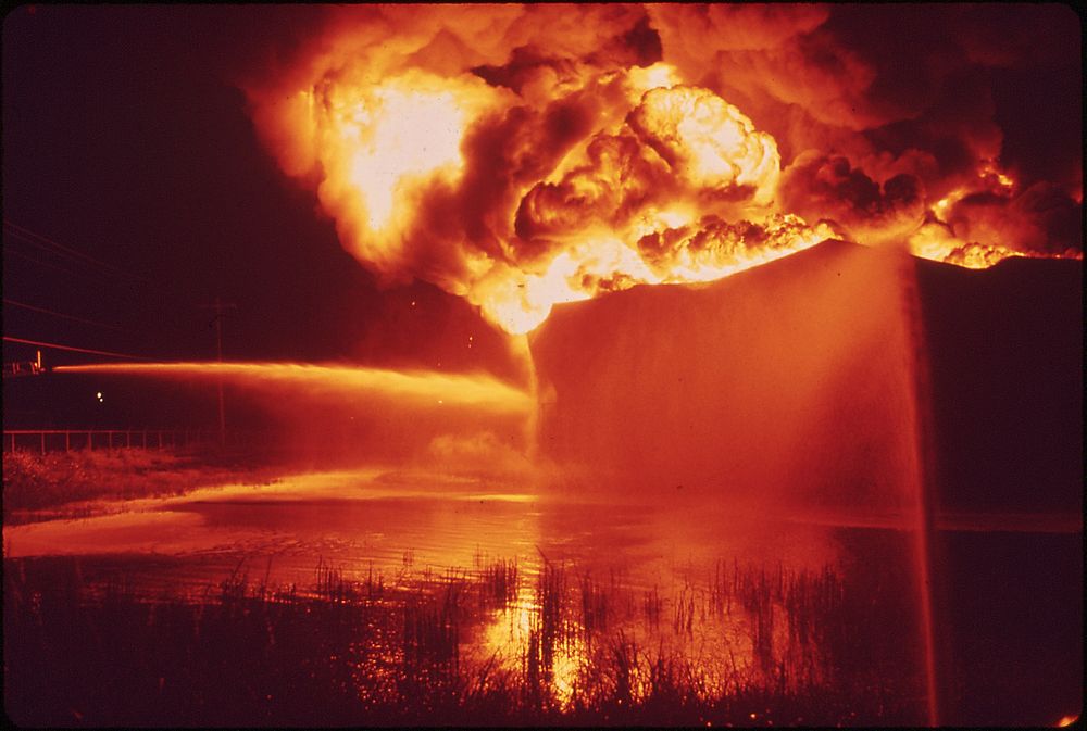 A Texaco Crude Oil Tank Blazes Against the Night after Being Struck by Lightning. Original public domain image from Flickr