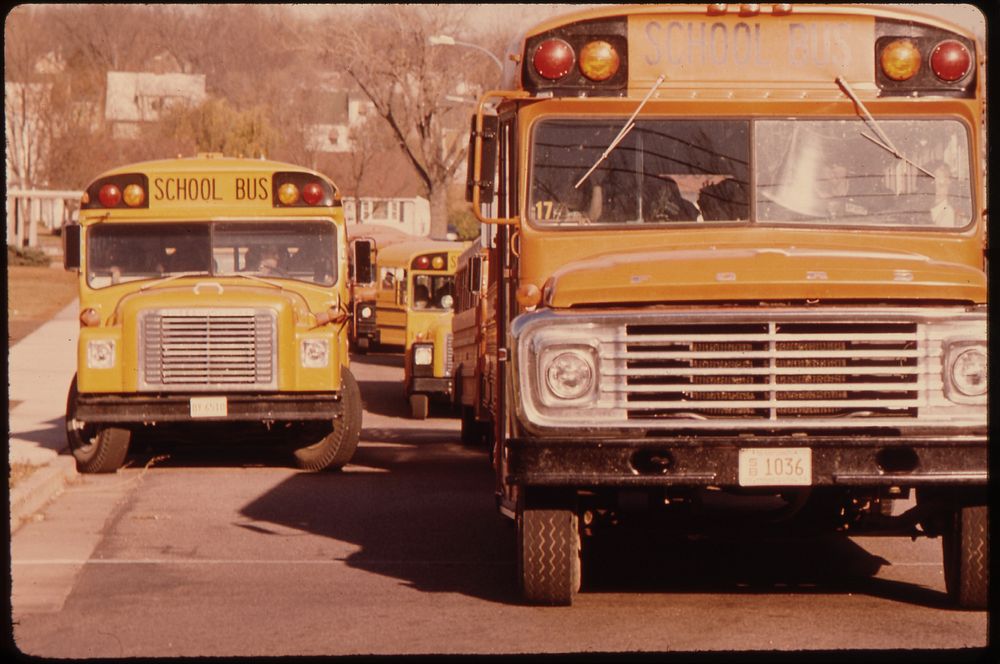 Students Arriving by Schoolbus at Senior High School in New Ulm, Minnesota.