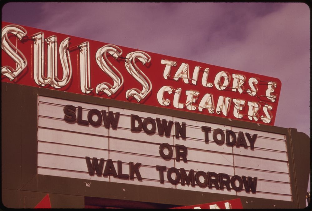 Unlighted Business Sign Reminds Motorists to Conserve Gasoline During the Fuel Crisis 12/1973. Photographer: Falconer…