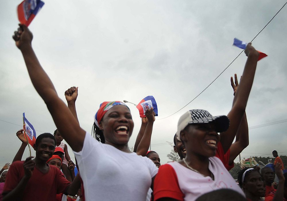 Earthquake survivors sing and dance on Toussant Boulevard to gospel music being played in Port-au-Prince, Haiti, Jan. 26…