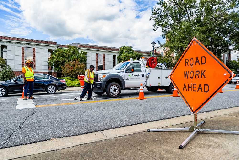 Traffic ServicesGreenville Public Works Traffic Services employees repair road markings on Evans Street in Uptown…